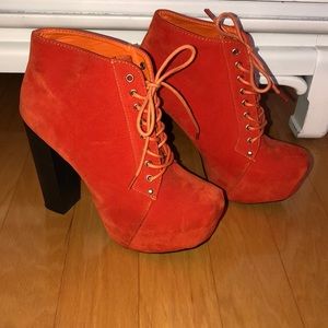 Orange suede laced up booties with 5-in black heel